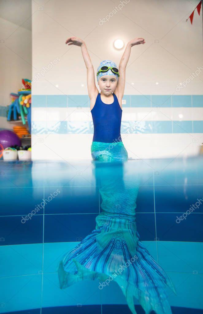 little girl in a mermaid costume