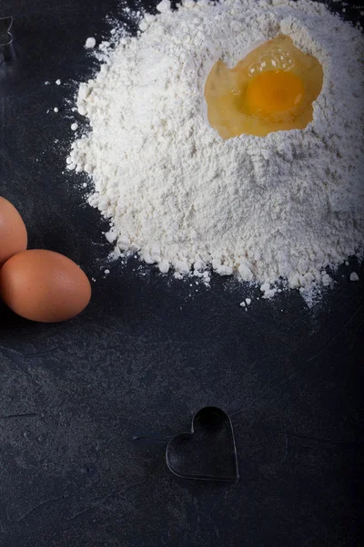Cookie cutter, eggs and flour — Stock Photo, Image