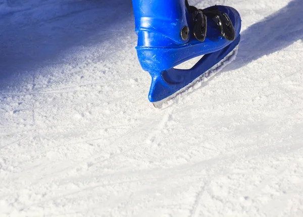 People skating with blue skates — Stock Photo, Image