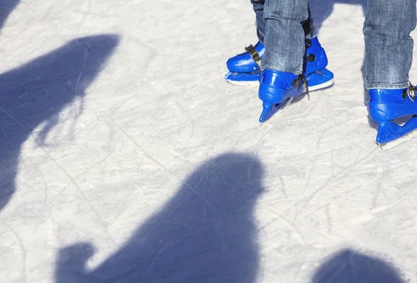 People skating with blue skates — Stock Photo, Image