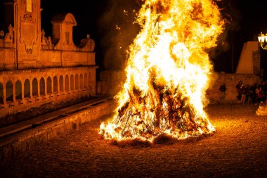 LEONFORTE, SICILY - APRIL, 19: Big fire next to the Granfonte fountain during the traditional Good Friday procession on April 19, 2019