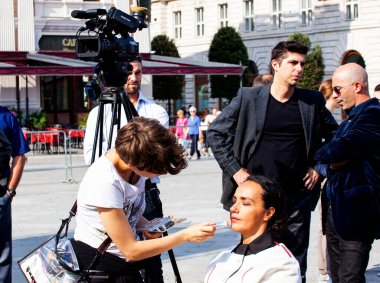 TRIESTE, ITALY - SEPTEMBER, 07: The makeup artist does makeup for beauty actress on September 07, 2016