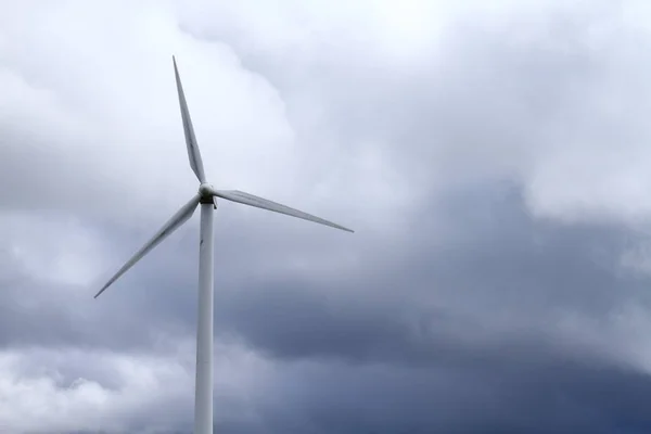 Wind turbine spinning wildly in strong wind — Stock Fotó