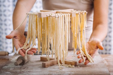 Traditional home made pasta drying clipart