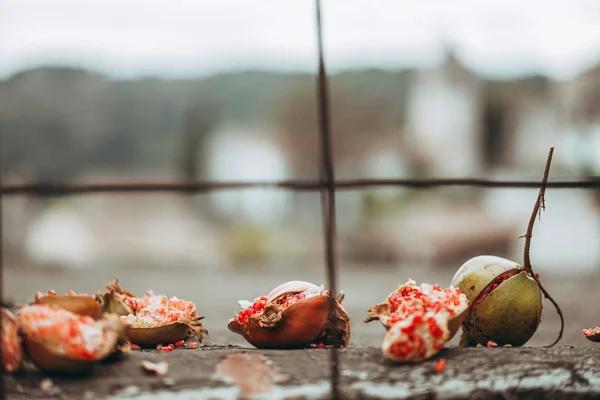 LOLLOVE, SARDINIA / OCTOBER 2019: pomegranate fruits on za stone — Stock Photo, Image