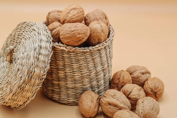 Healthy organic walnuts in a straw basket — Stock Photo, Image