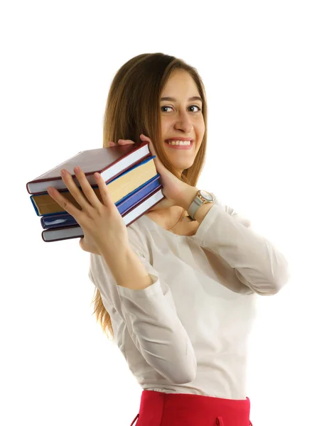 Student meisje houdt stapel boeken in handen — Stockfoto