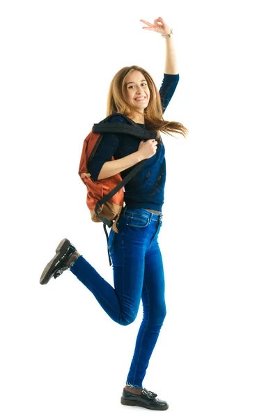 Menina com uma mochila e pastas de cores — Fotografia de Stock