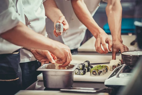 Busy chef at work in the restaurant kitchen — Stock Photo, Image