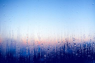 Clear water drops on the glass window. Background. clipart