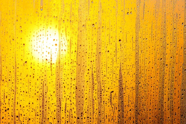 The sun through the glass window. Water drops. — Stock Photo, Image