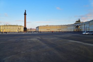 Saint Petersburg, Russia - January 31, 2020: View on building of headquarters of Guards Corps, Alexander Column, and General Staff Building on Palace Square  at sunset