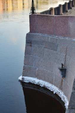Saint Petersburg, Russia - January 31, 2020: Small   bronze sculpture of Chizhik-Pyzhik, a well-known folk character, the embankment of the river Fontanka, St. Petersburg