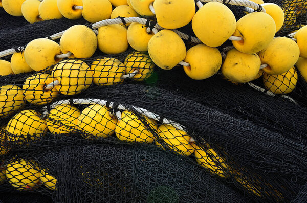 Black fishing net with orange corks, Mahe island, Seychelles