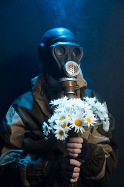photo of girl in gas mask on grey background c daisies clipart