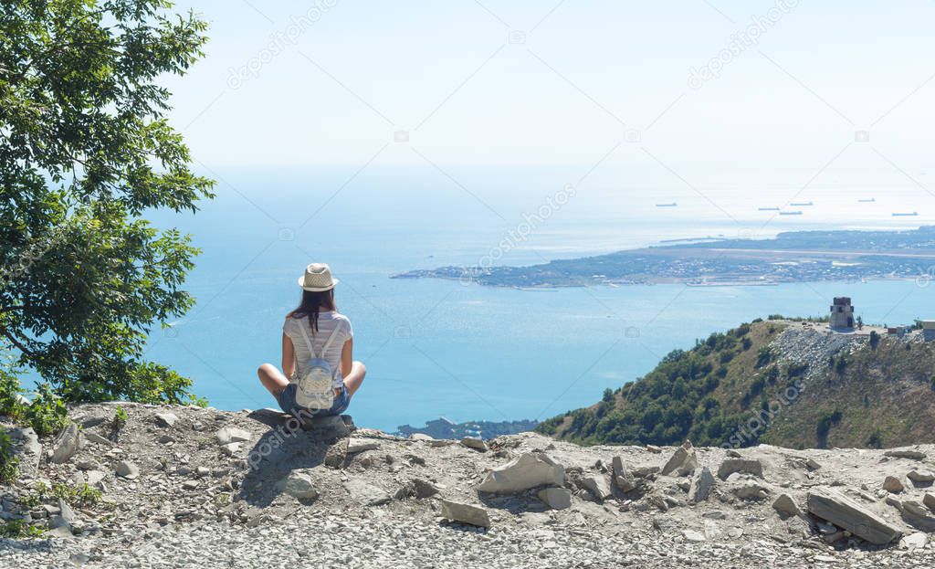 guy and a girl on top of a mountain with sea views