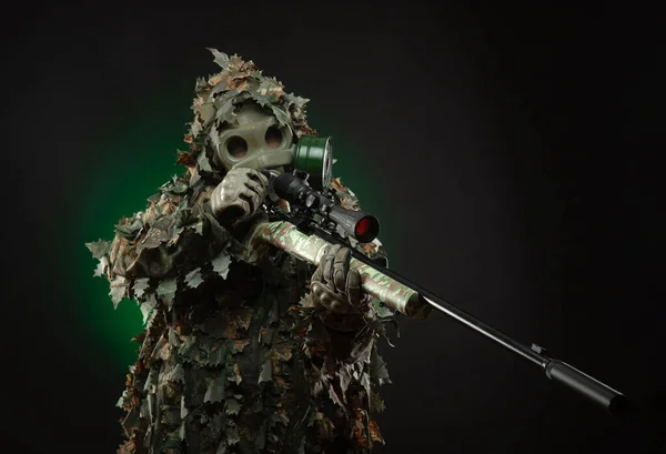 A sniper in a camouflage suit poncho and gas mask with a sniper rifle — Stock Photo, Image