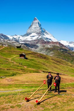 Swiss alphorn blowers in Switzerland clipart