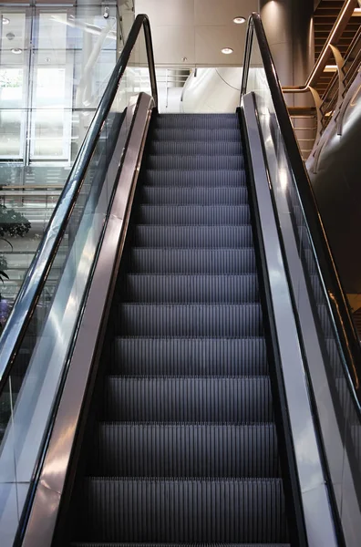 Empty escalator in modern train station.