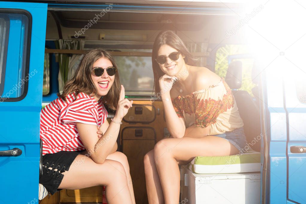 Young women travelling by minivan