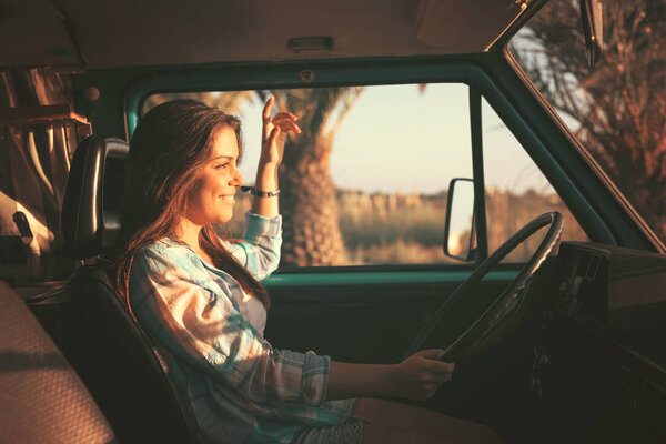 Young woman enjoy travelling by car