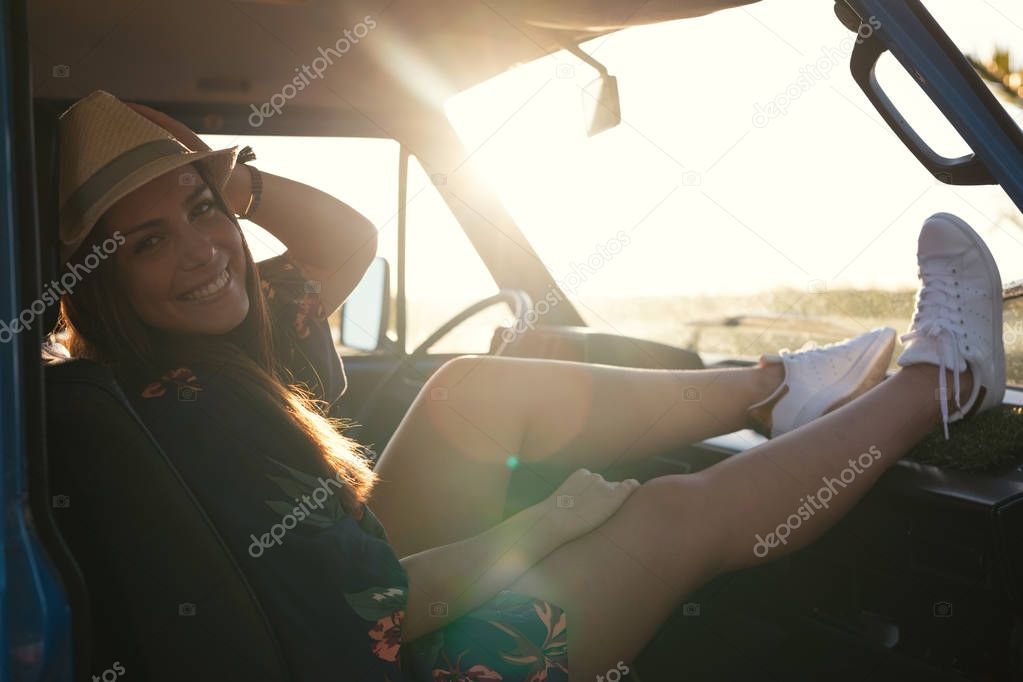 Young woman enjoy travelling by car