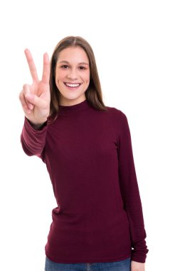 Beautiful young woman signaling ok, isolated over white background clipart