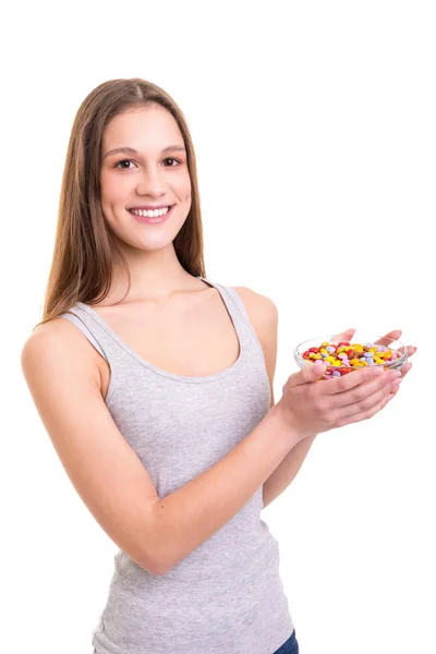 Jonge Vrouw Met Een Boog Van Kleurrijke Chocolade Snoepjes Geïsoleerd — Stockfoto