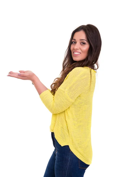 Young Woman Presenting Product White Background — Stock Photo, Image