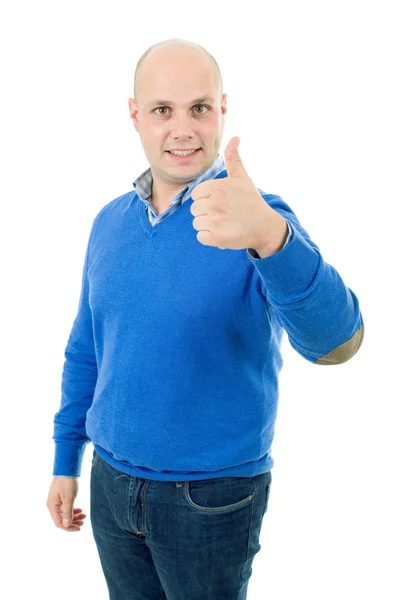 Young casual man going thumbs up, isolated on white — Stock Photo, Image