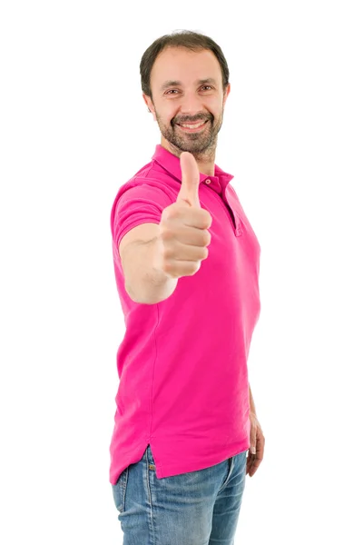 Young casual man going thumbs up, isolated on white background — Stock Photo, Image