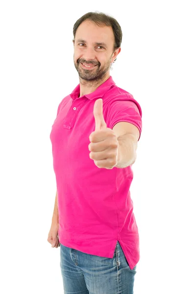 Young casual man going thumbs up, isolated on white — Stock Photo, Image