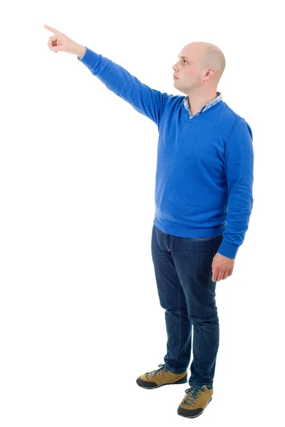 Beyaz bir arka plan üzerinde işaret ederek, genç casual adam tam vücut izole — Stok fotoğraf