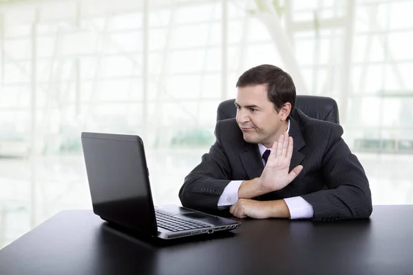 Young businessman working with is laptop at the office — Stock Photo, Image