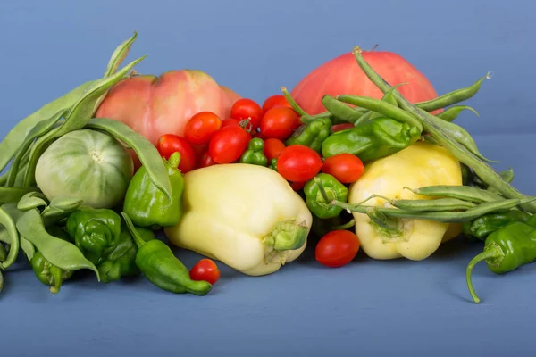 Vegetables on a blue wooden surface — Stock Photo, Image