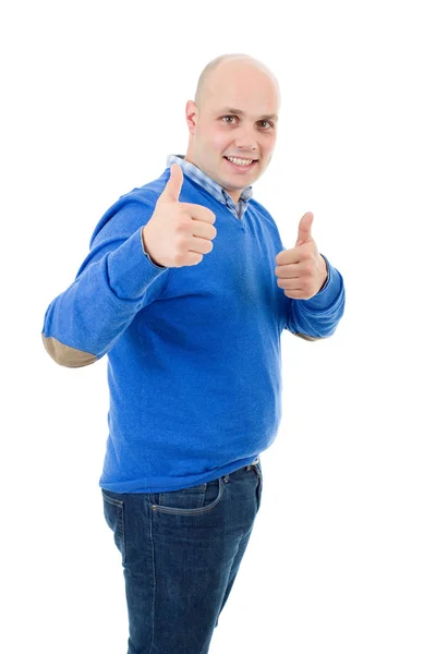 Young casual man going thumbs up, isolated on white background — Stock Photo, Image