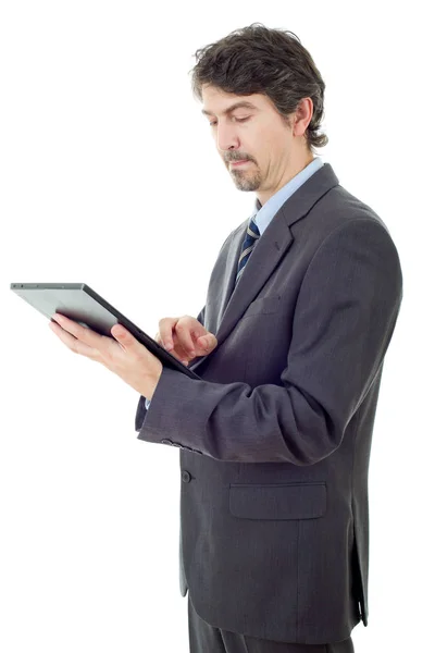 Jonge zakenman werkt met een tablet pc, geïsoleerd — Stockfoto