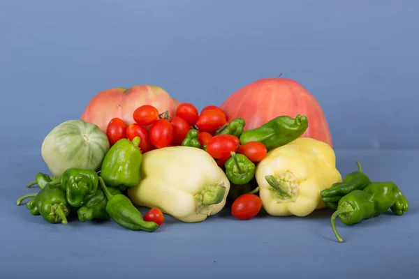 Vegetables on a blue wooden surface — Stock Photo, Image
