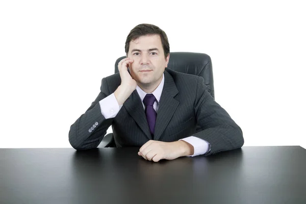 Young business man on a desk, isolated on white — Stock Photo, Image