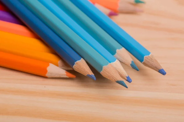 Wooden colorful pencils, on wooden table — Stock Photo, Image