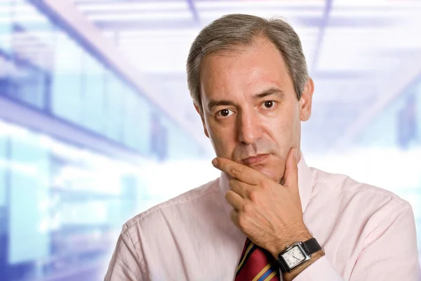 Mature business man thinking at the office — Stock Photo, Image