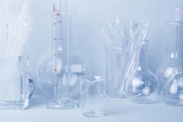 Research lab assorted glassware equipment in blue tone — Stock Photo, Image