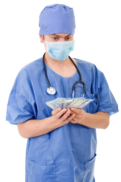 Szczęśliwy lekarz trzymając pieniądze, na białym tle — Zdjęcie stockowe