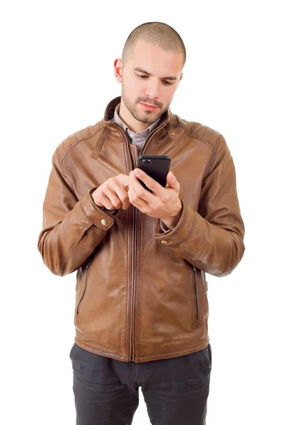 Jeune homme heureux occasionnel avec un téléphone, isolé — Photo