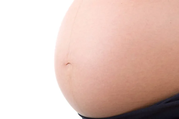 Closeup of pregnant woman at white background — Stock Photo, Image