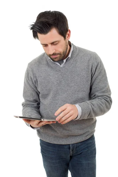 Випадковий чоловік дивиться на планшетний ПК, ізольований — стокове фото