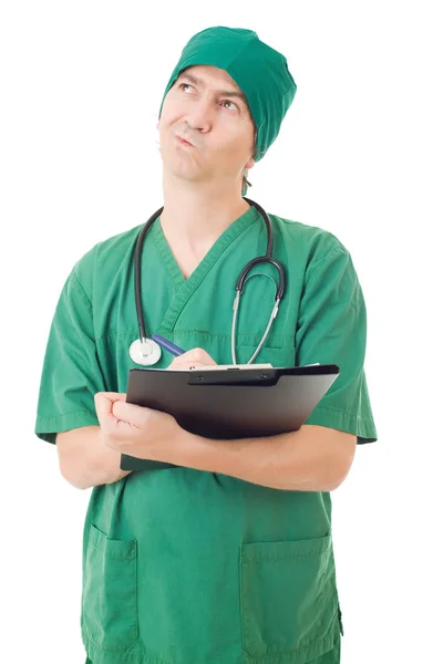 Verpleegkundige denken met zijn aantekeningen, geïsoleerd op witte achtergrond — Stockfoto