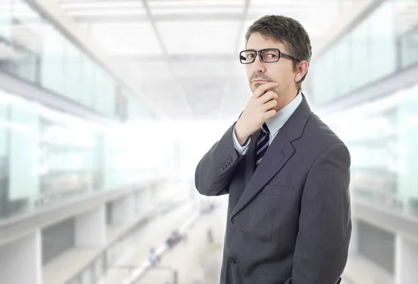 Young business man thinking at the office — Stock Photo, Image