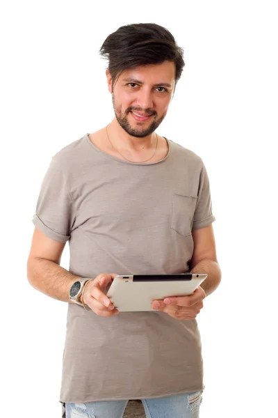 Casual man aan het werk met zijn tablet pc, geïsoleerd — Stockfoto