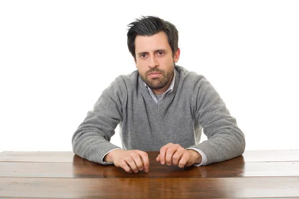 Homem triste em uma mesa, isolado — Fotografia de Stock